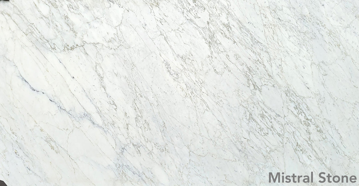Bianco Miele premium white marble slab featuring delicate soft honey gold and amber veining with customizable finishes by Mistral Stone