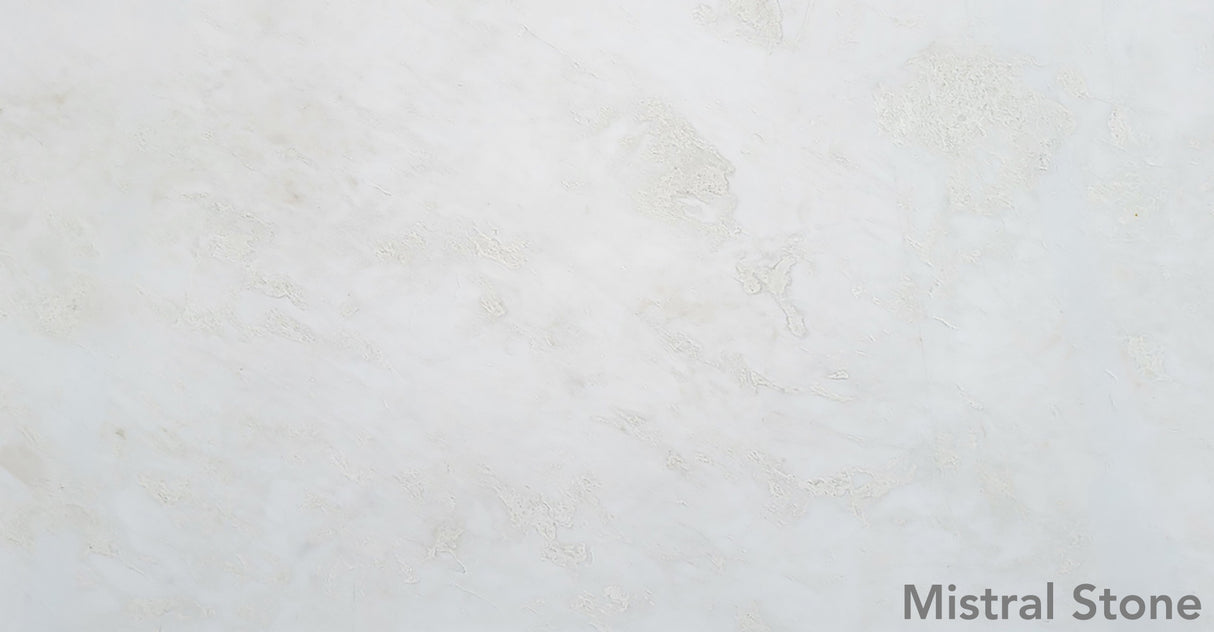 Bianco Rhino premium pure white marble slab featuring ultra-clean minimalist ivory cloud patterning with customizable finishes by Mistral Stone