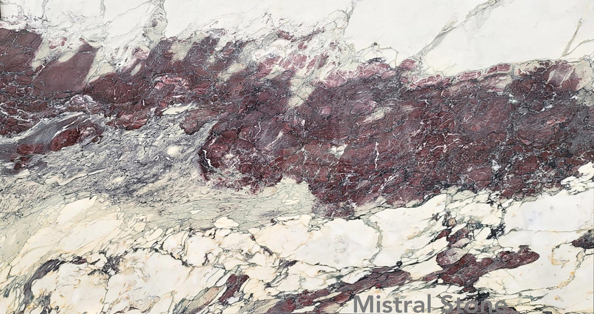 Breccia Capraia Extra Burgundy premium Italian marble slab featuring an intense horizontal band of deep wine red and burgundy brecciated veins with customizable finishes by Mistral Stone