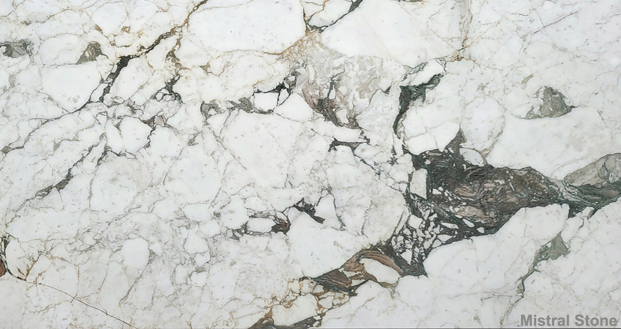 Premium Calacatta Vagli Monet marble slab featuring a classic Italian brecciated white background with painterly sage green, tobacco brown, and charcoal veining by Mistral Stone