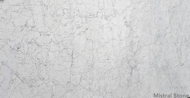 Bianco Carrara premium Italian white marble slab also known as Carrara White featuring timeless soft grey feathered veining with customizable finishes by Mistral Stone