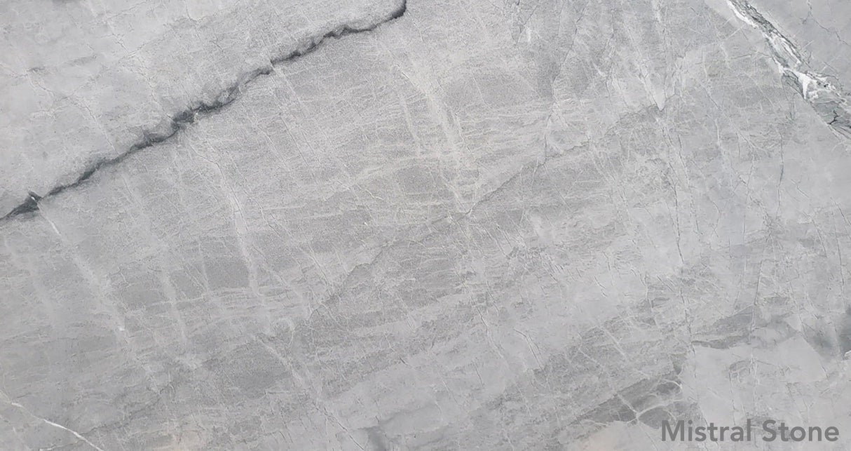 Blue de Savoie premium blue grey marble slab featuring elegant fine white linear veining with customizable finishes by Mistral Stone
