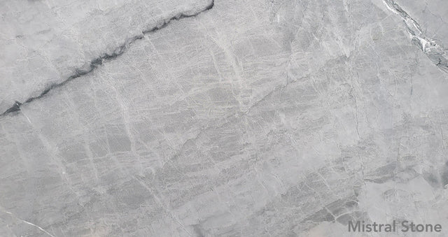 Blue de Savoie premium blue grey marble slab featuring elegant fine white linear veining with customizable finishes by Mistral Stone