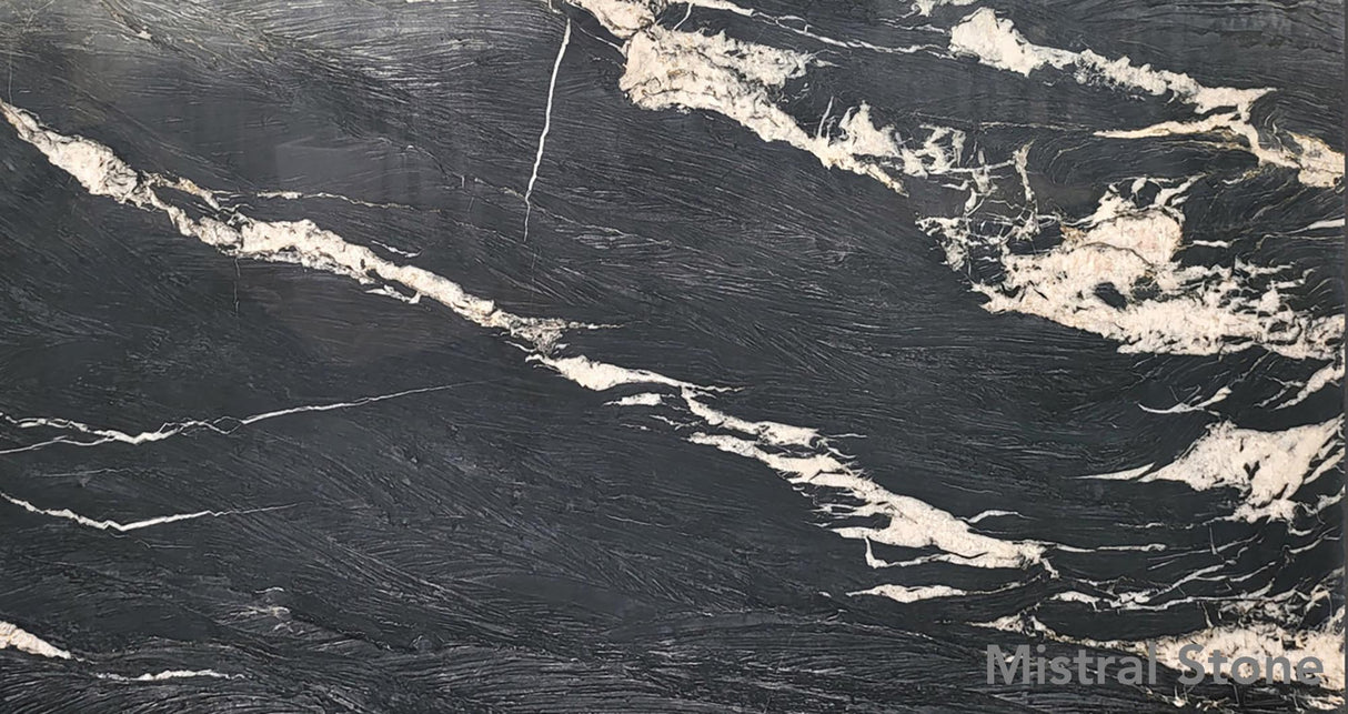 Brindle Crystal premium exotic quartzite slab featuring intense dark charcoal background with dramatic sweeping crystalline white and cream veins by Mistral Stone