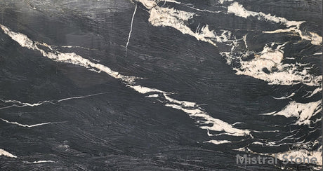 Brindle Crystal premium exotic quartzite slab featuring intense dark charcoal background with dramatic sweeping crystalline white and cream veins by Mistral Stone