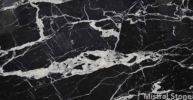 Calacatta Black premium marble slab featuring intense jet black background with dramatic bold crystalline white veins with customizable finishes by Mistral Stone