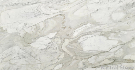 Premium Calacatta Cremo marble slab featuring rich warm ivory background with sweeping golden cream and soft grey veining with customizable finishes by Mistral Stone
