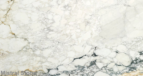 Premium Calacatta Soft Monet marble slab featuring a soft brecciated alabaster white canvas with subtle sage green, light gold, and charcoal grey pathways with customizable finishes by Mistral Stone