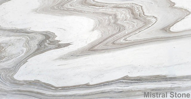 Premium Calacatta Wave marble slab featuring a dramatic fluid wave topography of taupe greige silver grey and mink brown layers on a luminous white background with customizable finishes by Mistral Stone